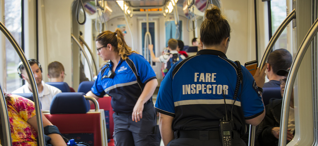 UTA Police officers on TRAX vehicle